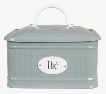 Bild av grön plåtburk med fack och ribbad textur