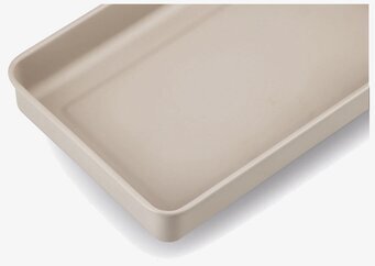 Bild av stor beige plåtburk med stilren och modern design