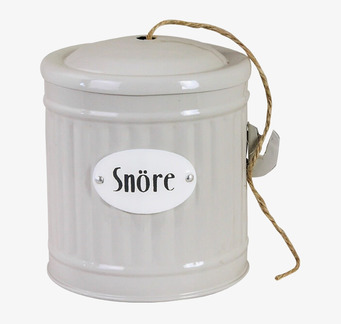 Bild av stilren och praktisk beige plåtburk för snöre