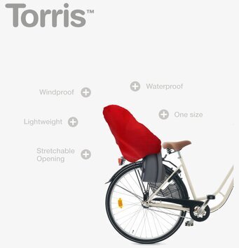 Bild av cykel med rött sadelöverdrag och pakethållare