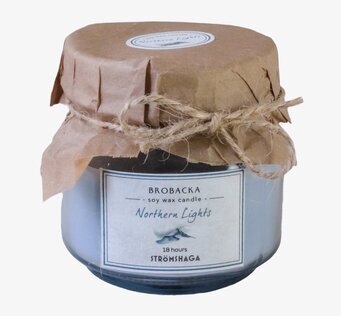 Bild av doftljus i glasburk med rustik pappersdetalj