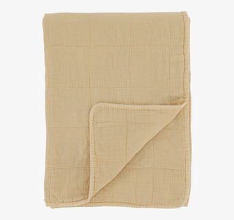 Bild av stilren pläd i mjuk melonnyans med rutmönster