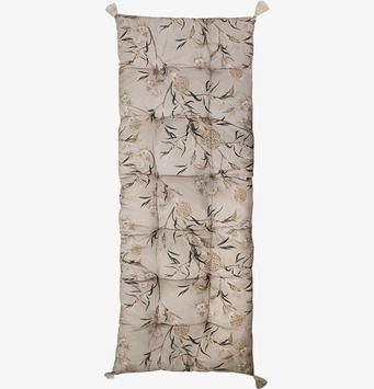 Bild av blommig golvmadrass i taupe med tofsdetaljer