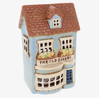 Bild av charmig ljuslykta som föreställer gammalt bageri