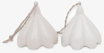 Bild av dekorativa klockor i beige och vit nyans