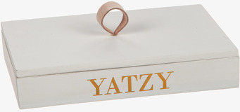 Bild av stilren rektangulär ask med guldfärgade bokstäver