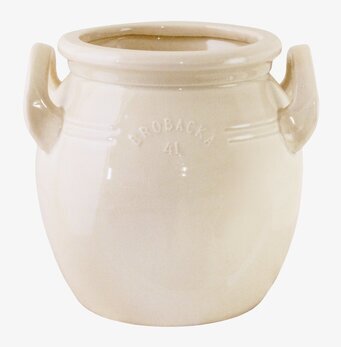 Bild på krämvit keramikkruka med handtag och reliefdekor