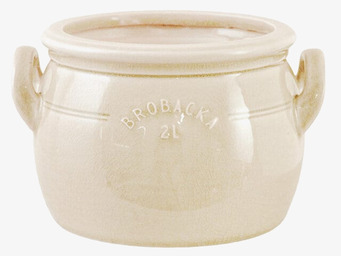 Bild på låg keramikkruka med lock och handtag i krämvitt