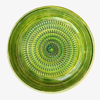 Bild av keramiskt rivjärn i gröna toner med handgjord känsla