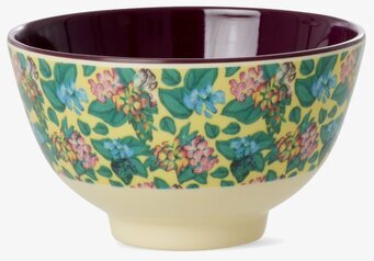 Bild av liten skål med blommigt mönster och vinröd insida