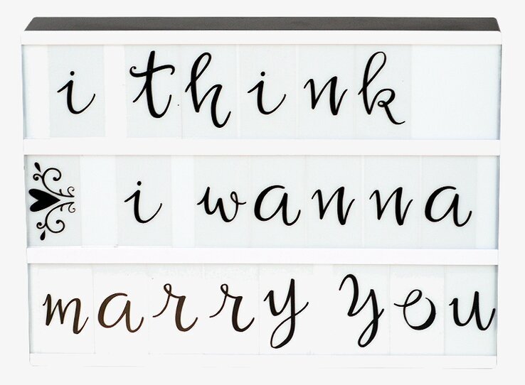 Bild av stilren ljuslåda med romantisk text och design