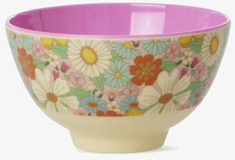 Bild av liten skål med färgstarkt blommönster och lila insida