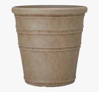 Bild på stilren blomkruka med patina och diskreta detaljer