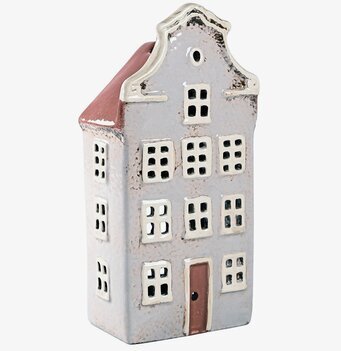 Bild av dekorativ ljuslykta som föreställer ett miniatyrhus