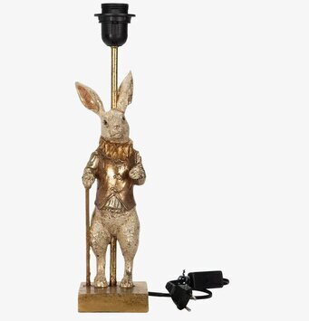 Bild på gyllene lampfot i form av stående kanin med käpp