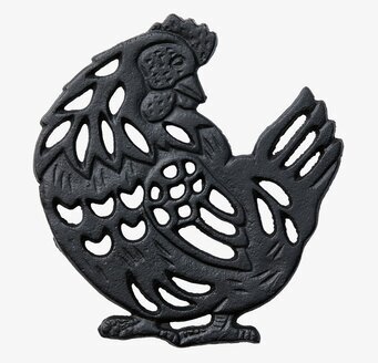 Bild av svart grytunderlägg i form av höna i gjutjärn