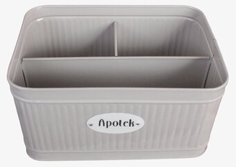 Bild på beige plåtburk med avdelare och räfflad yta