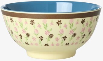 Bild på färgglad blommig skål med blå insida och brun kant