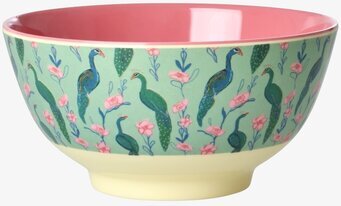 Bild på färgglad skål med påfåglar, blommor och rosa insida