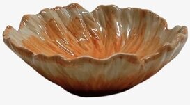 Bild av keramikskål med vågform och glaserade naturtoner