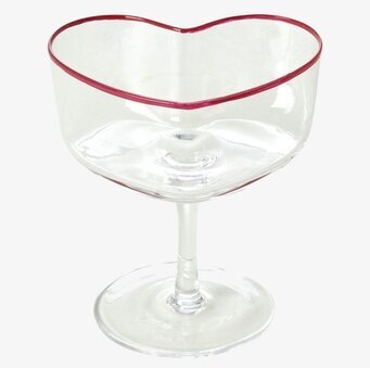Bild av elegant coupeglas med hjärtform och röd kant