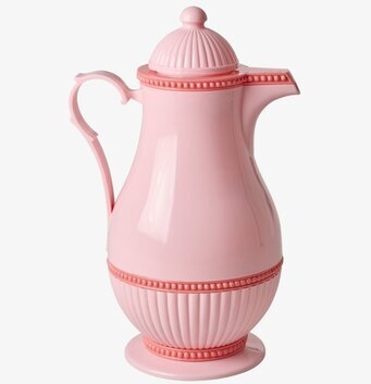 Bild av rosa termos med retrodesign och dekorativa detaljer