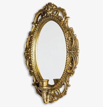 Bild på klassisk ljuslampett med spegel och guldfärgad ram