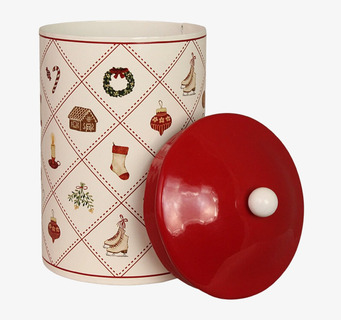 Bild av liten rund plåtburk med julmotiv och rött lock