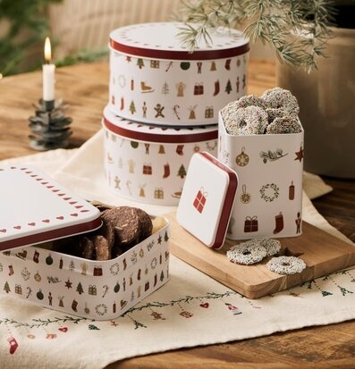 Bild: Juldukning med plåtburkar, kakor och klassiska motiv