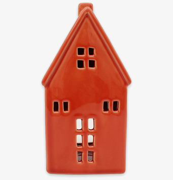 Bild av dekorativ ljuslykta som keramikfärgat hus med fönster