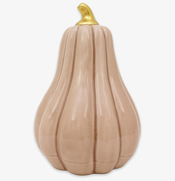 Bild på beige hög pumpa i keramik med guldfärgat skaft