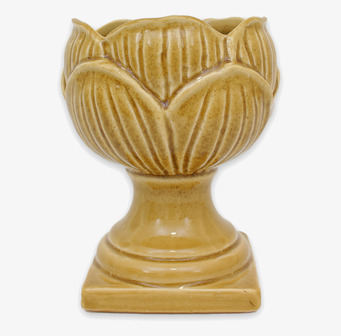 Bild på gul pokalkruka i keramik med vågformad öppning