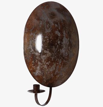 Bild av brun ljuslampett i metall med reflekterande yta