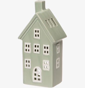 Bild på dekorativt keramikhus i grönt med ljuslyktfunktion