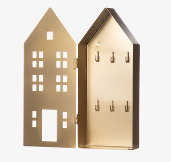 Bild av guldfärgat nyckelskåp i metall formad som ett hus