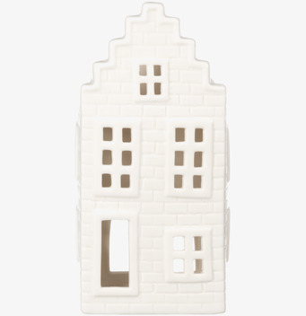 Bild av vit ljuslykta i form av hus med tegelmönster och fönster