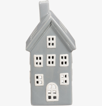 Bild av ljuslykta i form av grått hus med vita detaljer