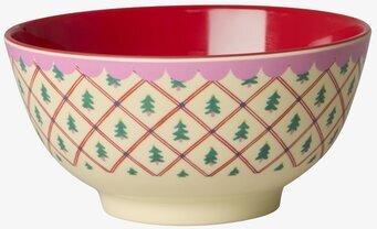 Bild på färgglad julskål med rutigt mönster och granar