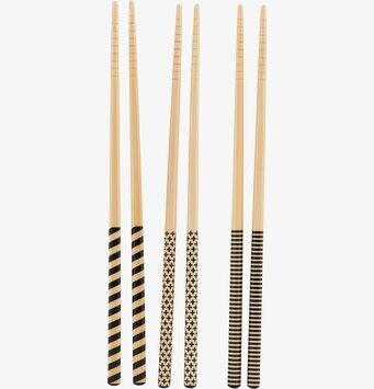 Bild av stilrena ätpinnar med unika mönster och design