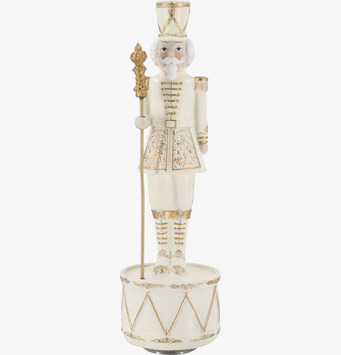 Bild på speldosa formad som nötknäppare med gulddetaljer