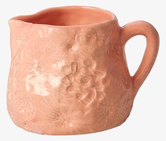 Bild av korallfärgad mjölkkanna med blommönster