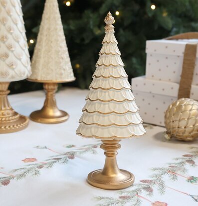 Bild av stilren julgransdekoration i creme och guld för julen