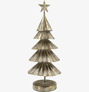 Bild av stiliserad julgran i antik mässing med stjärna på topp