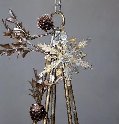 Bild på hängande dekoration i antik mässing med snöflinga