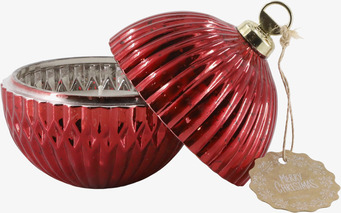 Bild av röd julkula med lock och ljus i dekorativ design