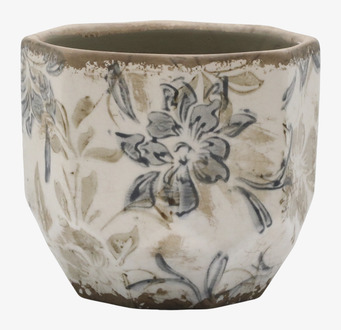 Bild av keramikkruka med blommigt mönster och sprucken glasyr