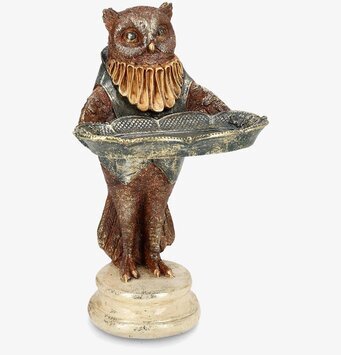 Bild av fantasifull uggledekoration med fat och fiskmotiv