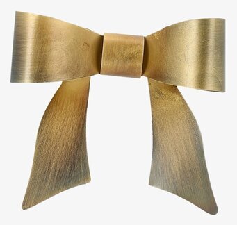 Bild av liten väggdekoration i guld – elegant metallrosett