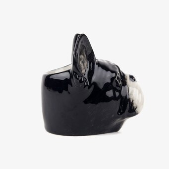 Bild av äggkopp med hundmotiv – detaljrik keramik i profil