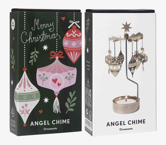 Bild på två askar med juliga ornament och änglaspel i fokus